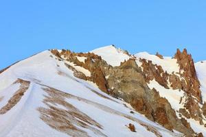 Strict and majestic peaks of Mount Erciyes on a clear sunny day in central Turkey. photo