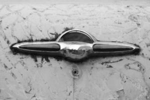 broken vintage car handle closeup, old metal vehicle weathered rusty parts photo