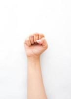 un gesto de la mano que muestra una mano fuertemente apretada, que significa éxito o espíritu. recopilación del lenguaje de señas mediante gestos con las manos. foto