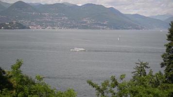 Lake Lago Maggiore Italy. Ship boat ferry glides through the water. video