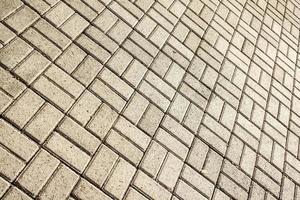 Diagonal view of pavement with geometric stone layer. photo