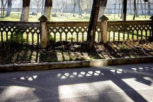 High contrast image of dark creative shadows on the road. photo