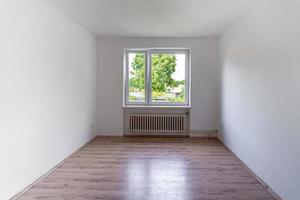 empty room with window and floor in a panel house photo