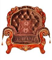 Luxurious soft armchair upholstered in expensive brown velor with mahogany wood frame, isolated on white background. photo