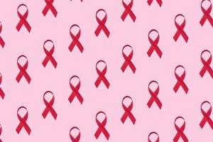 Red ribbons pattern symbol of world aids day on pink background photo