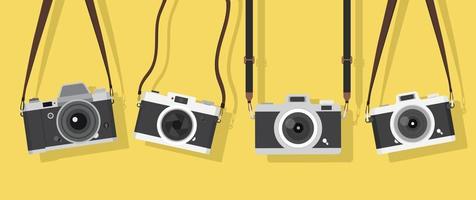 hanging vintage camera on color background vector