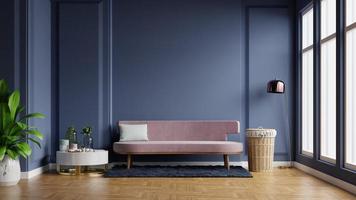 Interior of light room with sofa on empty dark blue wall background. photo