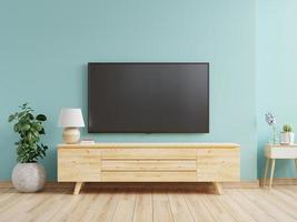 maqueta de un televisor montado en la pared de una sala de estar con una pared azul.
