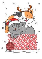 dos lindos gatitos navideños dibujados a mano en una caja vector