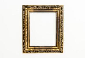 empty picture frame on white wall background photo