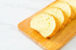 potatoes bread sliced on wood board photo