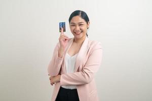 Asian woman holding credit card with white background photo