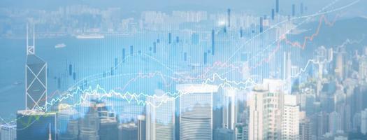 Smart city and stats concept with growing digital graphs and diagram on city background photo