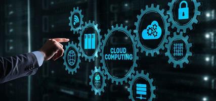 Cloud computing concept. Businessman is pressing on the virtual screen inscription Cloud computing photo