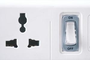 Electrical switch and plug on color background, photo