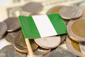 Stack of coins with Nigeria flag on white background. photo