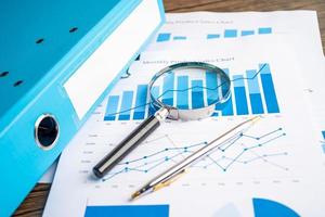 Binder data finance report business with graph analysis in office. photo