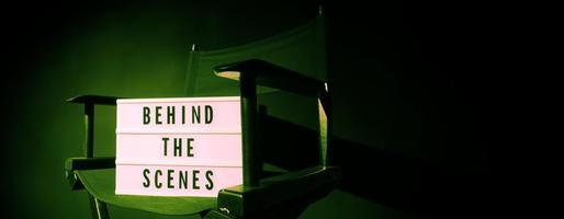 Director chair with behind the scene banner light box. photo