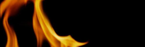 Fire background. Abstract burning flame and black background. photo