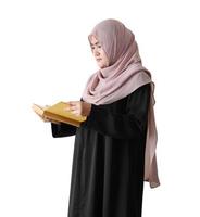 Muslim girl reading religion book on white background
