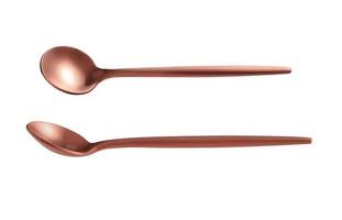Rose gold tea spoon on a white background