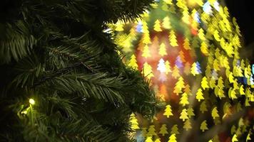 Artificial christmas tree with colorful bokeh light. video