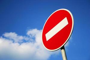 No entry traffic sign against clear blue sky photo