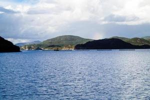 With a cruise ship in the fjords of norway photo