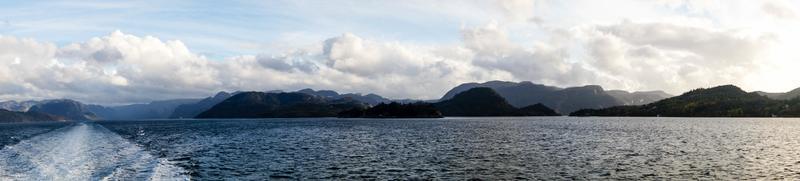 With a cruise ship in the fjords of norway photo