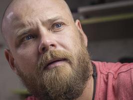 Portrait of a bald man with a beard photo