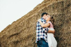 a guy with a girl on a summer walk in the field photo
