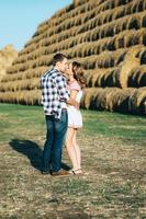 a guy with a girl on a summer walk in the field photo