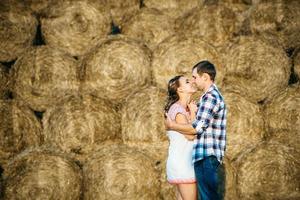 a guy with a girl on a summer walk in the field photo