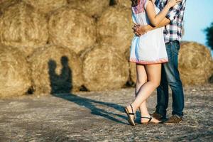 a guy with a girl on a summer walk in the field photo