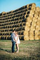 a guy with a girl on a summer walk in the field photo