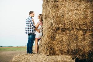 a guy with a girl on a summer walk in the field photo