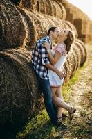 a guy with a girl on a summer walk in the field photo