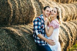 a guy with a girl on a summer walk in the field photo