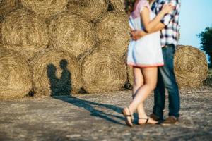 a guy with a girl on a summer walk in the field photo