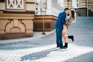 guy and a girl happily walk in the morning on the empty streets photo