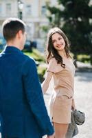 guy and a girl happily walk in the morning on the empty streets photo