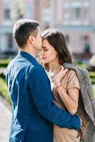 guy and a girl happily walk in the morning on the empty streets photo