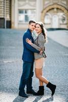 guy and a girl happily walk in the morning on the empty streets photo