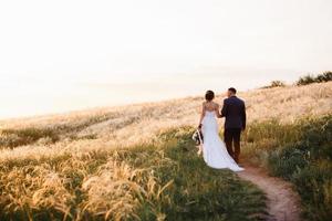 A couple in love a guy and a girl on a walk in the forest belt photo