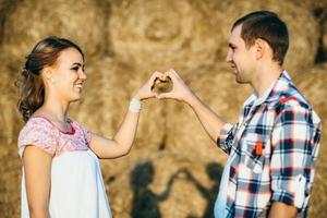 a guy with a girl on a summer walk in the field photo