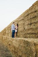 a guy with a girl on a summer walk in the field photo