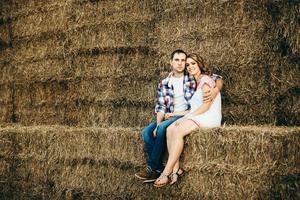 a guy with a girl on a summer walk in the field photo