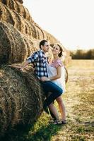 a guy with a girl on a summer walk in the field photo