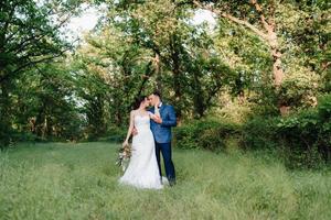 A couple in love a guy and a girl on a walk in the forest belt photo