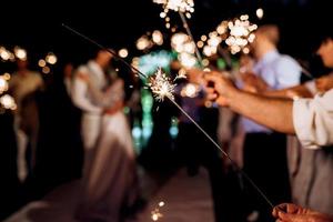 sparklers at the wedding of the newlyweds photo